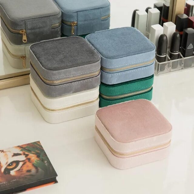 coloured velvet jewelry cases on a makup dressing table