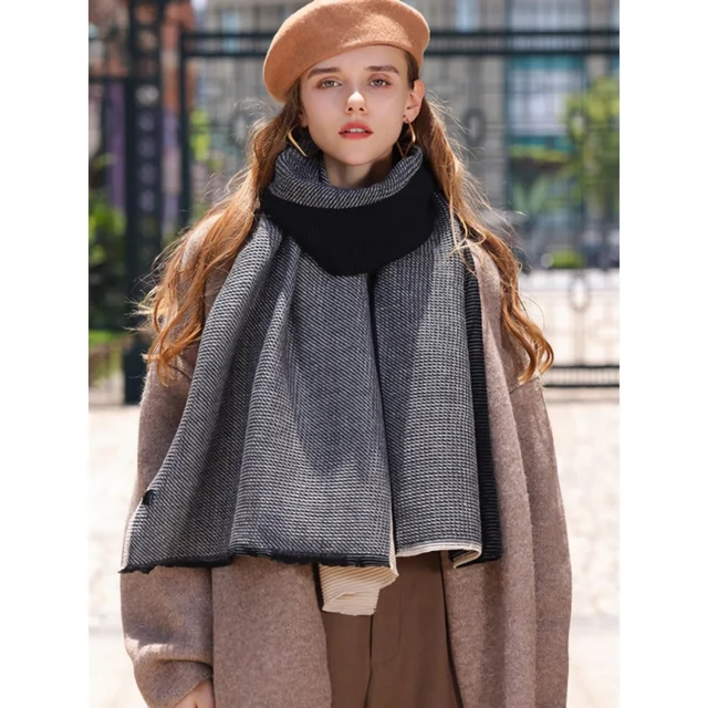 Lady in grey thick scalf with brown winter coat and beret