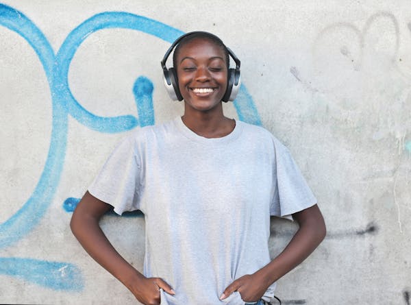 American wearing a T.shirt with stereo headphones on