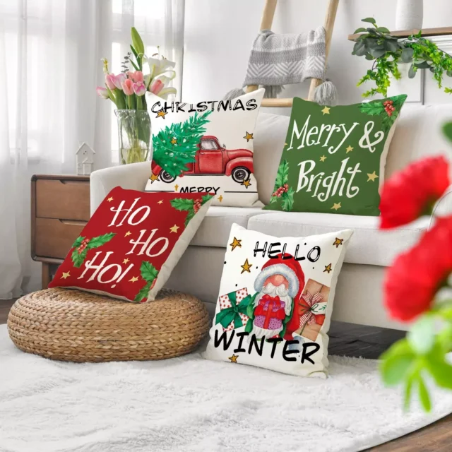 assorted christmas cushions in a lounge area in red and green with prints and font