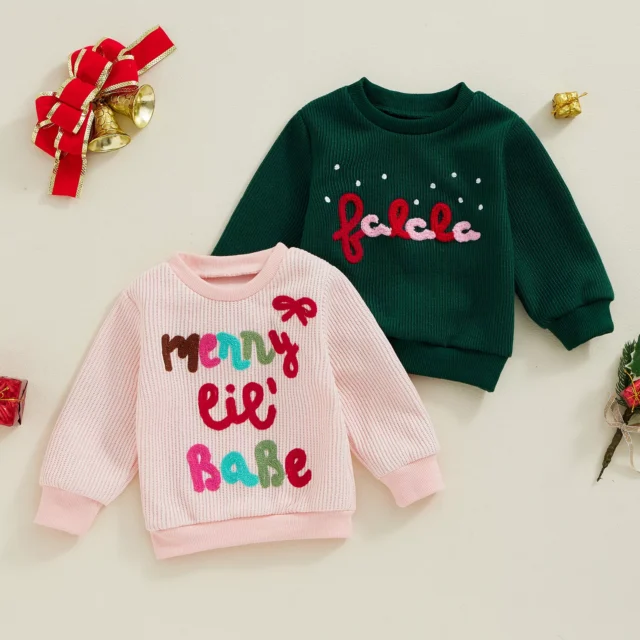 2 x baby sweaters in pink and dark green with writing